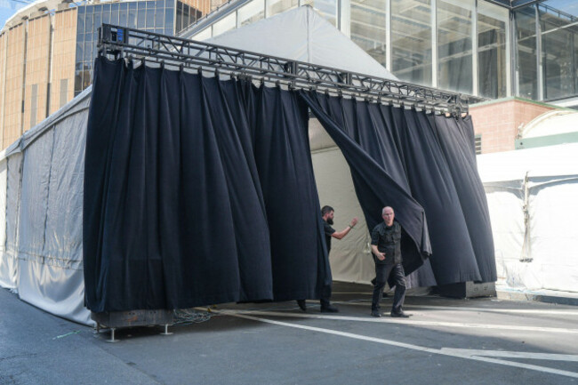 workers-walk-through-an-arrival-tent-outside-madison-square-garden-ahead-of-a-reported-wedding-between-singer-taylor-swift-and-national-football-league-player-travis-kelce-on-friday-july-3-2026-in