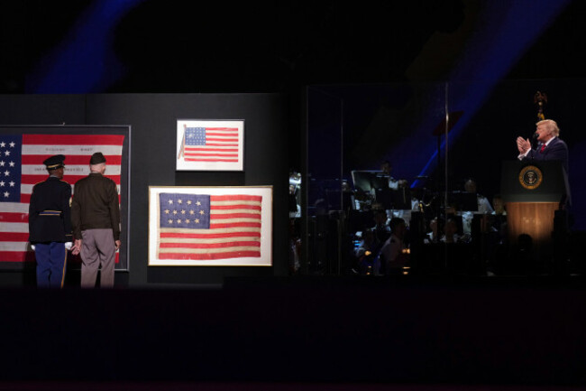 president-donald-trump-from-right-watches-as-paris-davis-the-first-medal-of-honor-recipient-stands-next-to-the-flag-from-the-casket-of-president-abraham-lincoln-top-right-at-salute-to-america-a