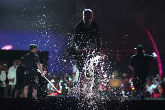 workers-clear-water-from-the-stage-before-president-donald-trump-speaks-at-an-independence-day-event-honoring-the-nations-250th-anniversary-saturday-july-4-2026-on-the-national-mall-in-washington