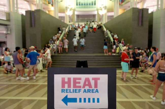 people-take-cover-in-the-ronald-reagan-federal-building-after-evacuating-the-national-mall-due-to-weather-while-attending-independence-day-events-honoring-the-nations-250th-anniversary-saturday-jul