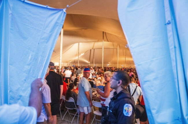 attendees-wait-in-a-shelter-tent-following-a-weather-delay-announcement-at-the-national-mall-during-an-independence-day-event-honoring-the-nations-250th-anniversary-saturday-july-4-2026-in-washin