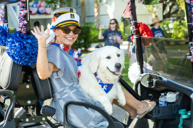 sullivans-island-united-states-of-america-04-july-2026-a-woman-and-her-dog-prepare-to-take-part-in-the-annual-bicycle-and-golf-cart-parade-celebrating-the-250th-independence-day-july-4-2026-in-s