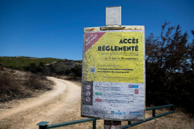 lancon-provence-france-04th-july-2026-a-sign-indicates-that-access-to-the-site-is-restricted-because-it-is-at-risk-of-forest-fires-illustration-of-the-damage-caused-by-the-fire-that-burned-more-t