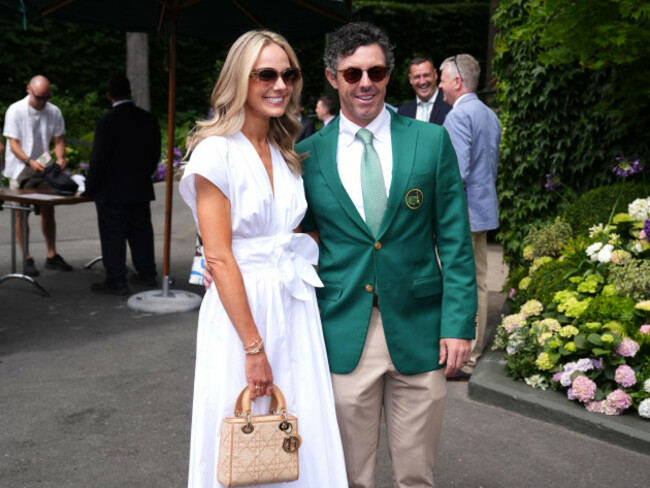 rory-mcilroy-right-wearing-his-masters-green-jacket-with-wife-erica-stoll-on-day-three-of-the-2026-wimbledon-championships-at-the-all-england-lawn-tennis-and-croquet-club-london-picture-date-we
