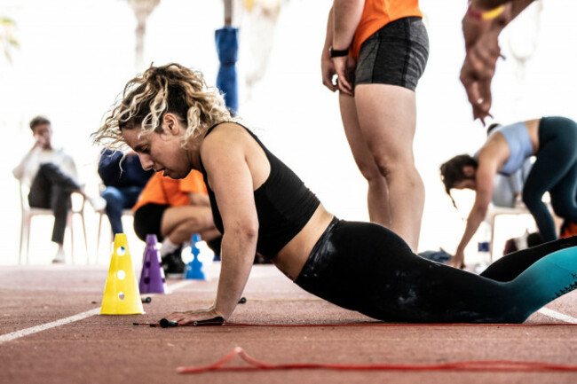 woman-in-burpee-broad-jump-ses-salines-amateur-crossfit-competition-mallorca-balearic-islands-spain