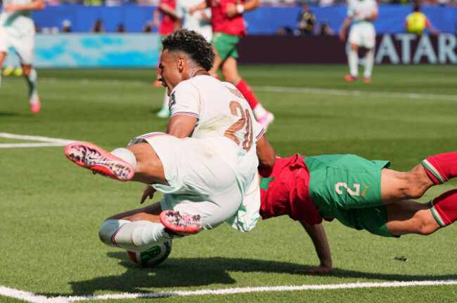 frances-desire-doue-20-commits-a-foul-against-moroccos-achraf-hakimi-2-during-the-world-cup-quarterfinal-soccer-match-between-france-and-morocco-in-foxborough-mass-near-boston-thursday-july