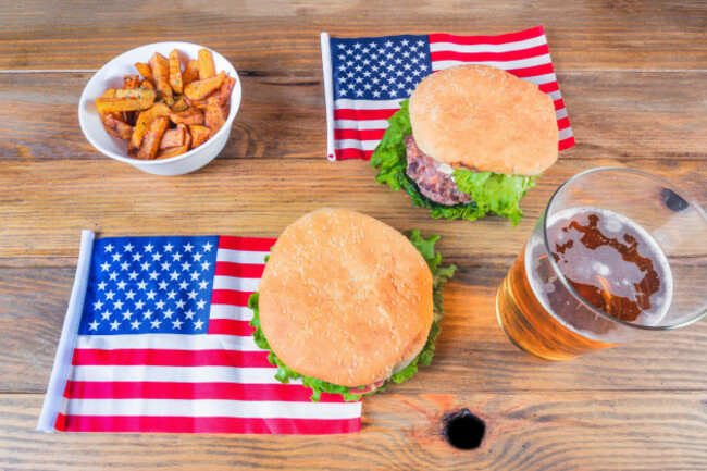 hamburger-with-french-fries-beer-and-a-u-s-flag-independence-day-4th-of-july-concept