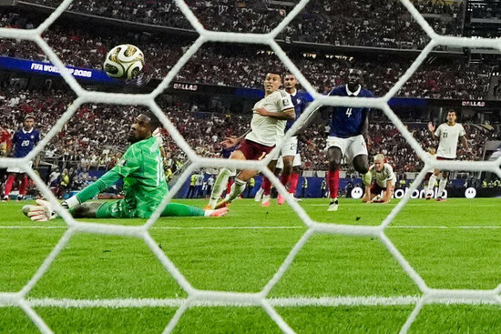 spains-pedro-porro-12-scores-their-second-goal-past-france-goalkeeper-mike-maignan-16-during-the-world-cup-semifinal-soccer-match-between-france-and-spain-in-arlington-texas-near-dallas-tuesda