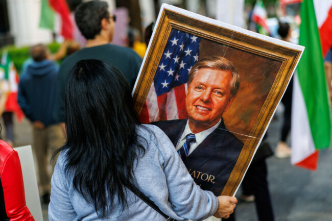 supporters-display-portrait-of-sen-lindsey-graham-at-iran-democracy-rally-washington-d-c-united-states-may-9-2026-archive-participants-display-a-portrait-of-u-s-senator-lindsey-graham-during-a
