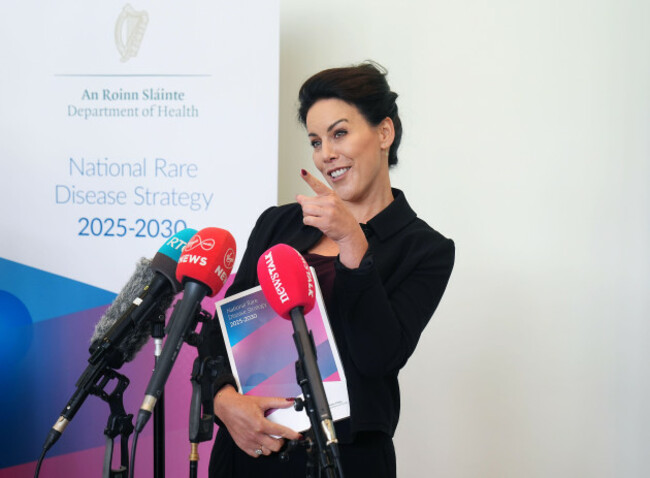 minister-for-health-jennifer-carroll-macneill-indicates-the-emergency-exit-as-an-alarm-goes-off-at-the-department-of-health-following-the-launch-of-the-national-rare-disease-strategy-2025-2030-in-dubl