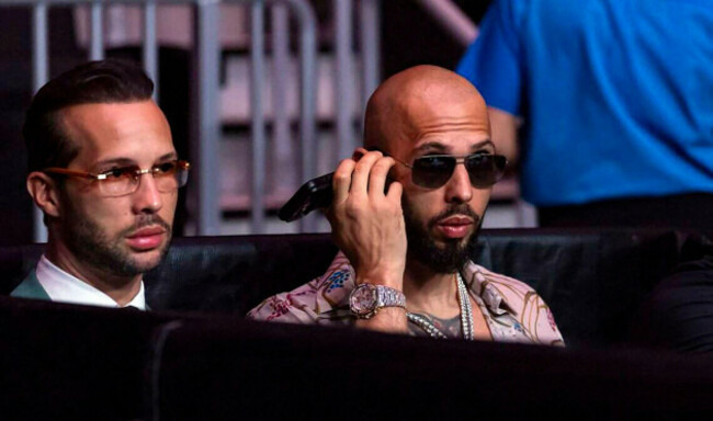 detroit-united-states-19th-july-2026-two-men-sit-in-seats-at-a-venue-in-michigan-on-july-19-2026-social-media-influencers-andrew-and-tristan-tate-were-arrested-in-miami-as-u-s-marshals-began-ex