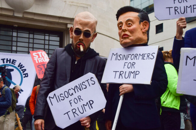 london-england-uk-17th-sep-2025-protesters-wearing-elon-musk-and-andrew-tate-masks-stand-outside-bbc-headquarters-at-the-start-of-the-protest-thousands-of-people-marched-against-donald-trump-in