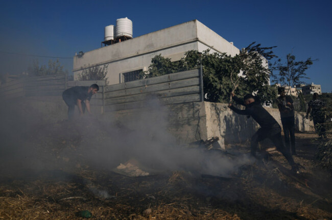 palestinians-work-to-extinguish-a-fire-following-an-attack-by-israeli-settlers-in-the-village-of-sarra-near-the-west-bank-city-of-nablus-friday-july-24-2026-ap-photomajdi-mohammed