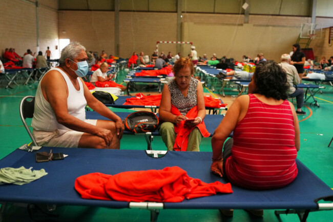 residents-spend-the-night-at-a-sports-center-after-being-evacuated-from-their-homes-because-of-the-threat-of-a-wildfire-in-cebreros-avila-province-spain-friday-july-24-2026-ap-photomanu-fernan