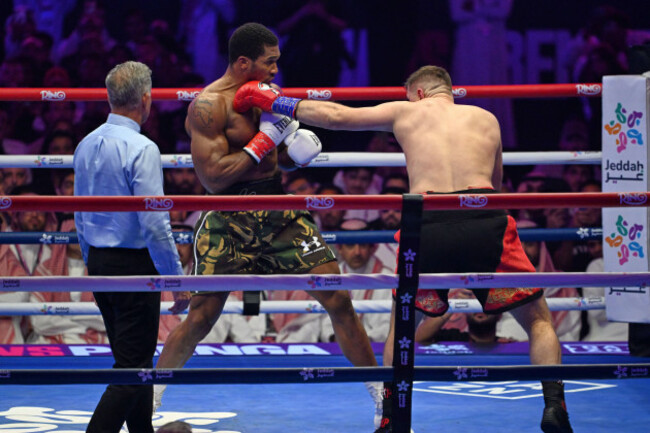 britains-anthony-joshua-left-battles-with-albanias-kristian-prenga-during-their-heavyweight-title-fight-in-jeddah-saudi-arabia-sunday-july-26-2026-ap-photoali-issa