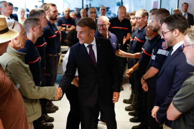 frances-president-emmanuel-macron-center-salutes-elected-officials-during-a-situation-briefing-in-the-crisis-room-at-the-departmental-fire-and-rescue-operational-center-codis-in-bordeaux-followi