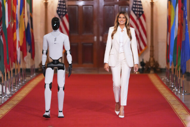 first-lady-melania-trump-arrives-accompanied-by-a-robot-to-attend-the-fostering-the-future-together-global-coalition-summit-with-other-first-spouses-at-the-white-house-wednesday-march-25-2026