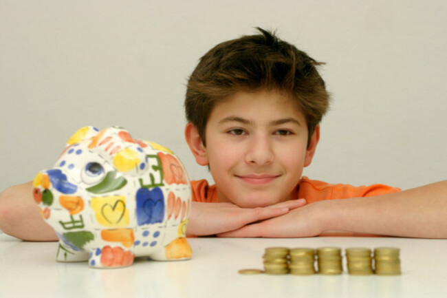 portrait-of-a-young-boy-happily-looking-at-his-saved-pocket-money-image-shot-2005-exact-date-unknown