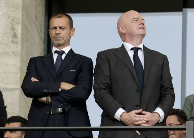 file-photo-dated-29062024-of-uefa-president-aleksander-ceferin-left-with-fifa-president-gianni-infantino-ceferin-says-taking-matches-away-from-their-community-roots-risks-breaking-football-iss