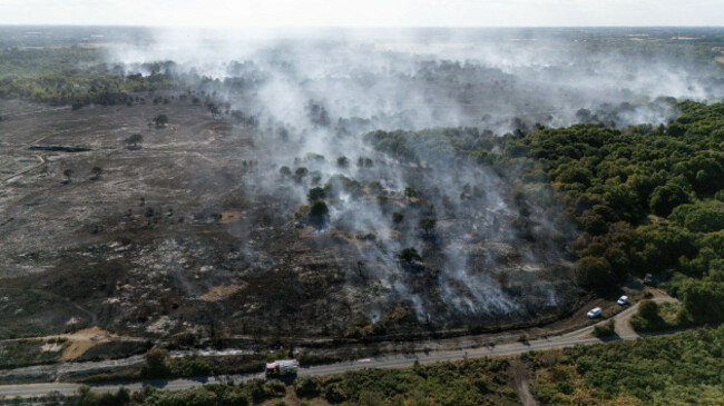 smoke-rises-from-the-smouldering-remains-of-a-wildfire-at-dunwich-heath-near-leiston-after-firefighters-battled-a-large-heathland-blaze-on-the-suffolk-coast-picture-date-friday-july-31-2026