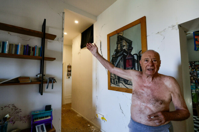a-resident-shows-the-damage-caused-to-his-house-by-the-magnitude-4-7-earthquake-that-struck-pozzuoli-near-naples-italy-saturday-aug-1-2026-alessandro-garofalolapresse-via-ap