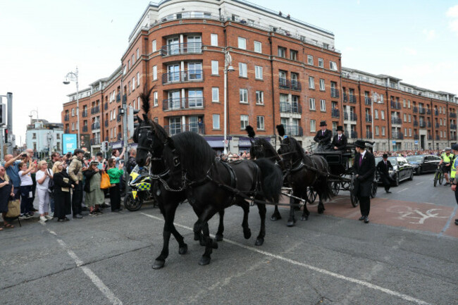 a-horse-drawn-hearse-takes-the-coffin-away-from-st-patricks-cathedral-in-dublin-following-the-funeral-of-glen-hansard-the-oscar-winning-irish-musician-and-activist-died-in-a-motorcycle-crash-last-w