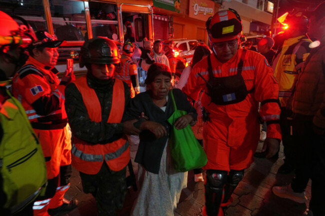 families-evacuated-from-areas-surrounding-the-fuego-volcano-arrive-at-a-temporary-shelter-in-san-juan-alotenango-guatemala-tuesday-aug-4-2026-ap-photomoises-castillo