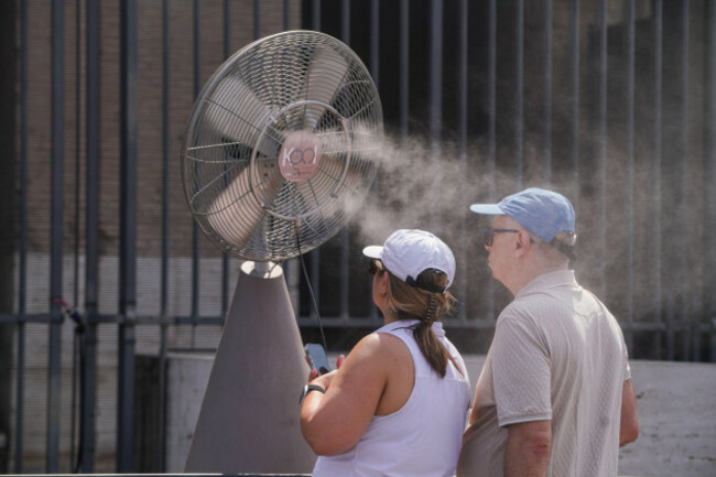 3-august-2026-tourists-are-sprayed-with-cooling-mist-at-the-colosseum-in-rome-during-a-severe-heatwave
