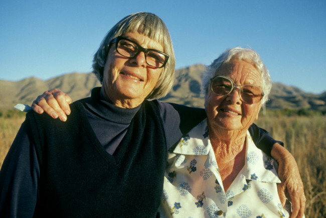 two-elderly-sisters-give-each-other-a-hug