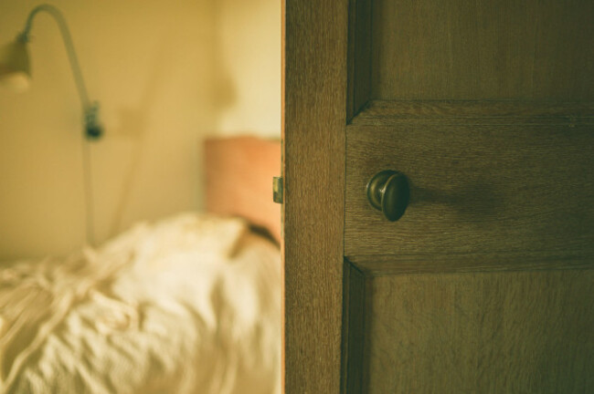 an-open-door-to-a-bedroom