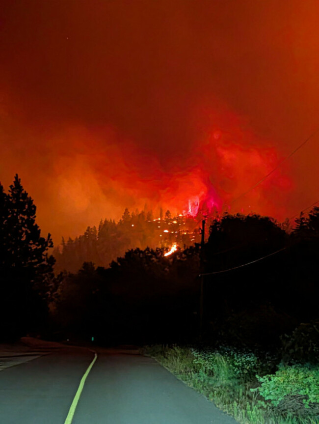 260809-ottawa-aug-9-2026-xinhua-this-photo-provided-by-the-bc-wildfire-service-on-aug-7-2026-shows-a-wildfire-on-a-roadside-near-okanagan-valley-in-the-southern-interior-of-british-colu