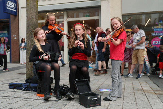 left-to-right-erin-donnelly-ceili-donnelly-beth-masterson-caragh-donnelly-from-ards-comhaltas-performing-in-donegall-place-in-belfast-as-fleadh-cheoil-na-heireann-2026-has-officially-opened-in