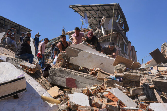 residents-look-for-survivors-through-the-rubble-of-a-collapsed-building-after-an-earthquake-struck-pereira-colombia-monday-aug-10-2026-ap-photovladimir-encima