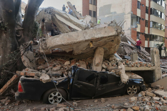 a-vehicle-is-crushed-by-debris-after-an-earthquake-struck-cali-colombia-monday-aug-10-2026-ap-photojuan-diaz