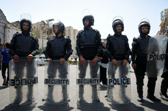 riot-police-stand-outside-the-palace-of-justice-during-a-court-session-that-sentenced-atef-najib-a-cousin-of-ousted-president-bashar-assad-to-death-for-overseeing-a-crackdown-in-daraa-that-helped-sp