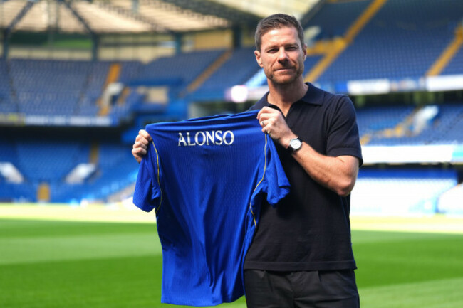 new-chelsea-manager-xabi-alonso-poses-for-photographs-holding-a-shirt-with-the-name-alonso-during-his-official-unveiling-at-stamford-bridge-london-picture-date-monday-july-13-2026