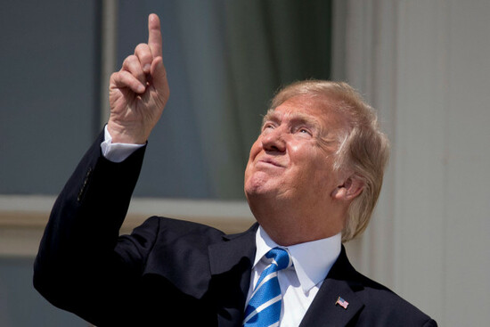 president-donald-trump-points-to-the-sun-as-he-arrives-to-view-the-solar-eclipse-monday-aug-21-2017-at-the-white-house-in-washington-ap-photoandrew-harnik