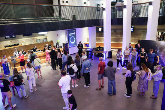 hamburg-germany-12th-aug-2026-a-large-crowd-is-waiting-in-a-long-line-at-the-hamburg-planetarium-to-buy-safety-glasses-for-safely-viewing-the-partial-solar-eclipse-this-evening-the-solar-eclipse