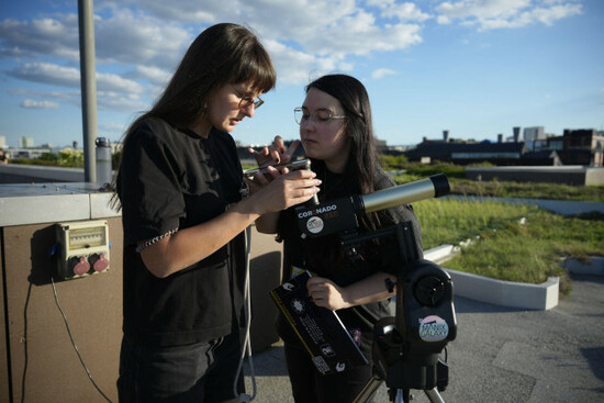 warsaw-poland-12th-aug-2026-people-use-solar-filter-glasses-to-observe-a-partial-solar-eclipse-at-the-copernicus-science-centre-in-warsaw-poland-on-august-12-2026-the-moon-covered-roughly-80-pe