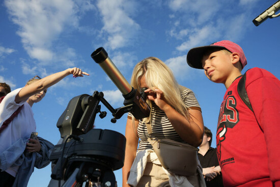 warsaw-poland-12th-aug-2026-people-use-solar-filter-glasses-to-observe-a-partial-solar-eclipse-at-the-copernicus-science-centre-in-warsaw-poland-on-august-12-2026-the-moon-covered-roughly-80-pe