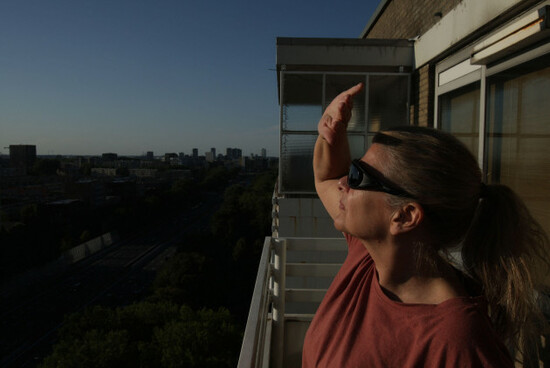 amsterdam-netherlands-12th-aug-2026-amsterdam-netherlands-august-12-a-local-watch-the-solar-eclipse-through-special-sunglass-on-august-12-2026-in-amsterdam-netherlands-the-solar-eclipse-in