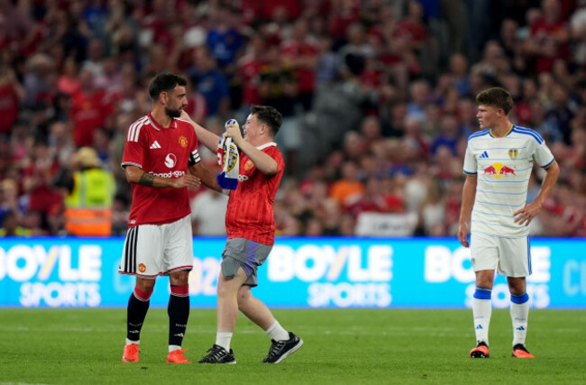 a-fan-runs-onto-the-pitch-as-he-attempts-to-greet-manchester-uniteds-bruno-fernandes-during-a-pre-season-match-at-croke-park-dublin-picture-date-wednesday-august-12-2026