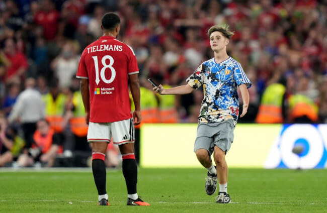 a-fan-runs-onto-the-pitch-as-he-attempts-to-take-a-selfie-with-manchester-uniteds-youri-tielemans-during-a-pre-season-match-at-croke-park-dublin-picture-date-wednesday-august-12-2026