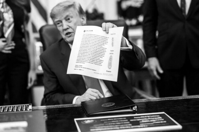 president-donald-j-trump-displays-information-concerning-childhood-vaccination-recommendations-during-an-oval-office-event-at-the-white-house-august-10-2026-image-courtesy-of-the-white-house