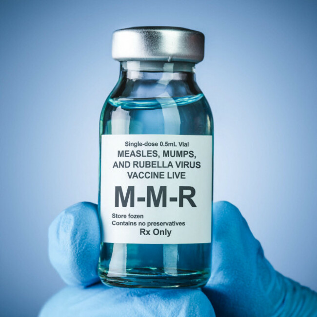 nurses-hand-in-blue-medical-gloves-holding-a-vaccine-bottle-with-mmr-text-health-care-concept-of-prevention-or-treatment-of-measles-mumps-and-rubel