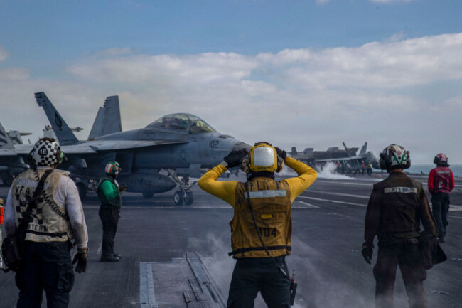 an-fa-18f-super-hornet-attached-to-strike-fighter-squadron-vfa-41-prepares-to-launch-from-the-flight-deck-of-nimitz-class-aircraft-carrier-uss-abraham-lincoln-cvn-72-in-support-of-operation-epi