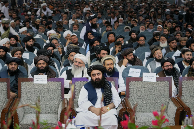 afghan-foreign-minister-amir-khan-muttaqi-center-sits-as-taliban-delegates-from-across-the-country-gather-for-a-meeting-opening-celebrations-marking-the-fifth-anniversary-of-the-u-s-withdrawal-and