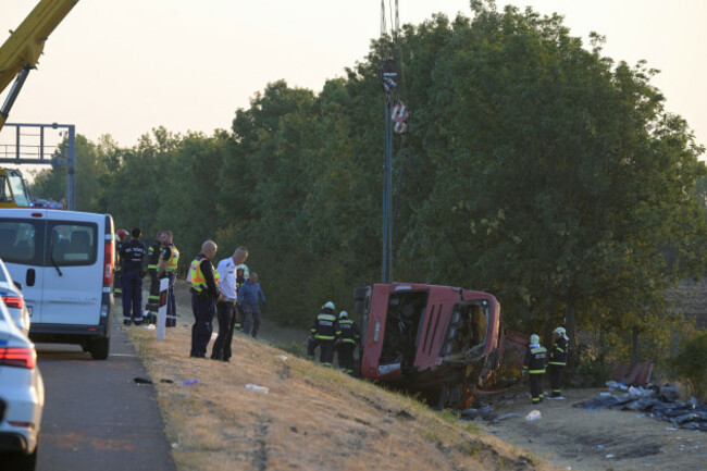 emergency-services-attend-the-scene-after-a-passenger-bus-went-off-the-road-and-overturned-in-a-ditch-along-a-highway-between-mezokeresztes-and-mezonagymihaly-in-hungary-sunday-aug-16-2026-zolta