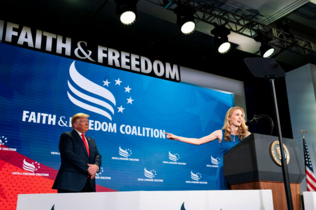 washington-united-states-of-america-26-june-2019-u-s-president-donald-trump-left-listens-to-natalie-harp-right-speak-after-inviting-her-on-stage-at-a-faith-and-freedom-coalition-road-to-major