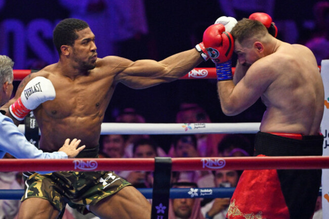 britains-anthony-joshua-left-lands-a-punch-on-albanias-kristian-prenga-during-their-heavyweight-title-fight-in-jeddah-saudi-arabia-sunday-july-26-2026-ap-photoali-issa